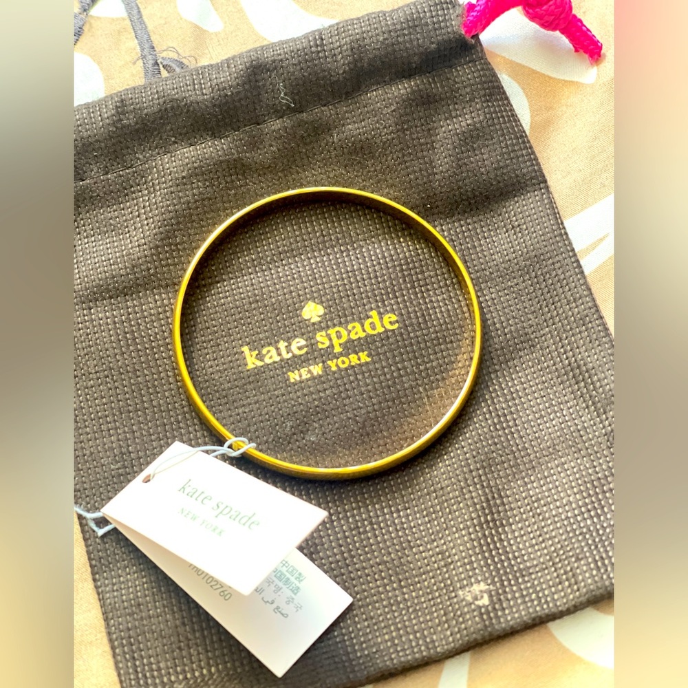 COPY - Gold Kate Spade bangle engraved with “Heart of Gold” on the inside. Neve…